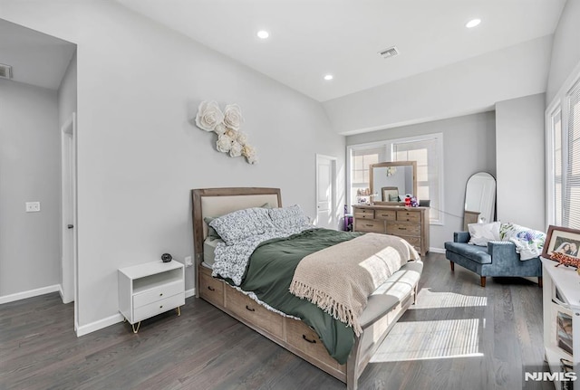 bedroom featuring dark hardwood / wood-style flooring and vaulted ceiling