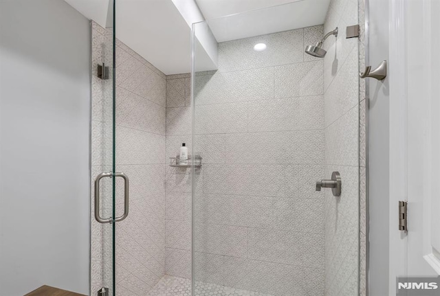 bathroom featuring an enclosed shower