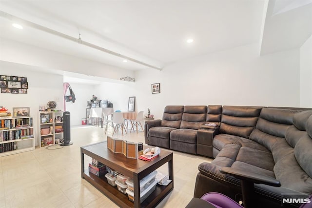 living room featuring beam ceiling