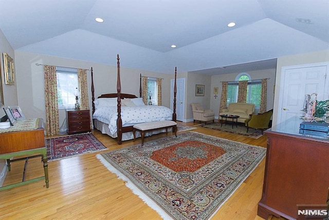 bedroom featuring lofted ceiling and wood-type flooring