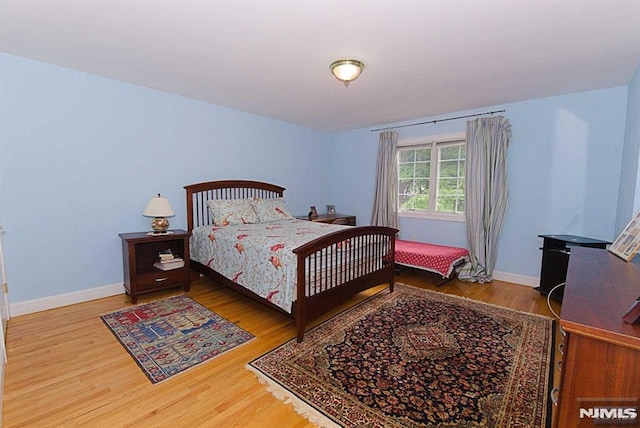 bedroom featuring wood-type flooring