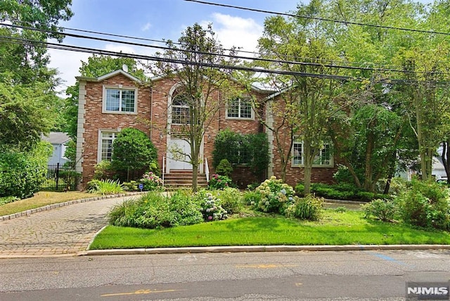 view of front of home with a front yard