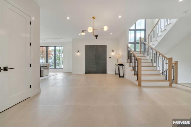 entryway featuring a notable chandelier