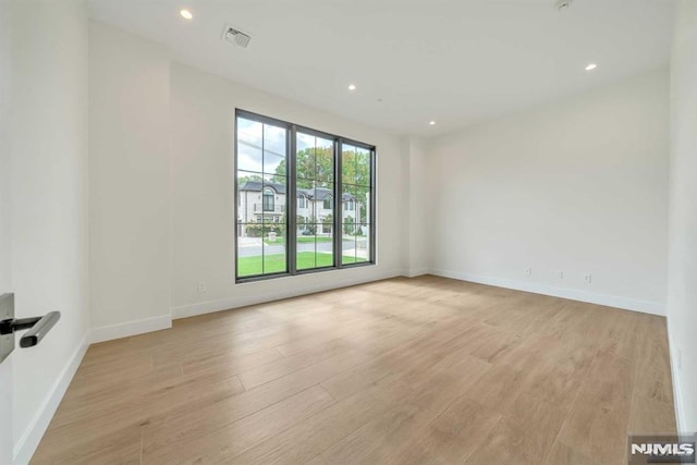 empty room with light wood-type flooring