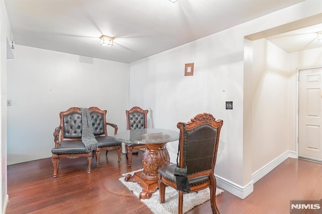 sitting room with hardwood / wood-style flooring