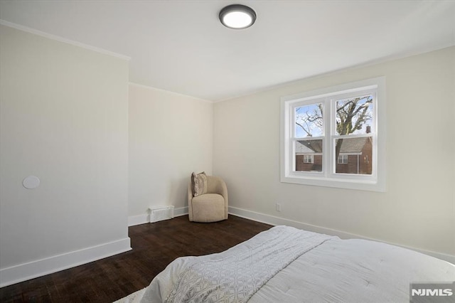 bedroom with wood-type flooring