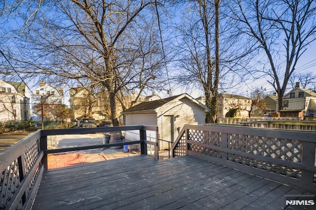 wooden deck featuring a storage unit