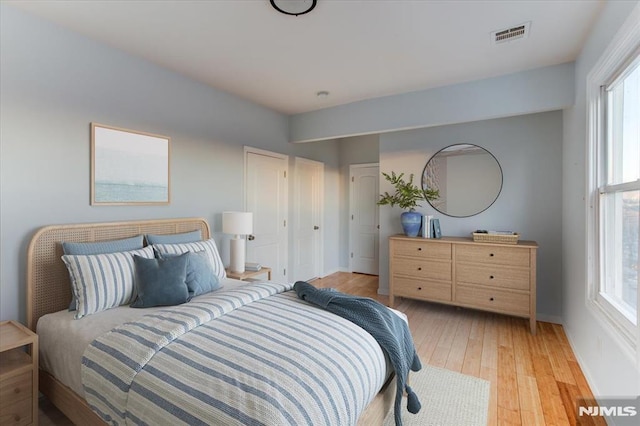 bedroom with light hardwood / wood-style floors