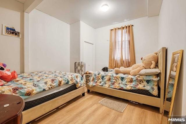 bedroom with hardwood / wood-style floors