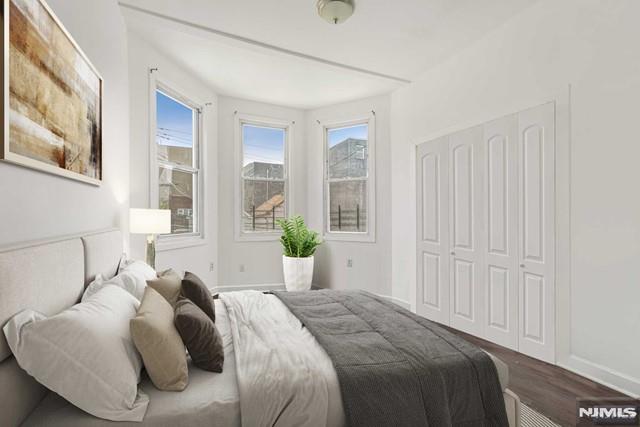 bedroom featuring wood-type flooring