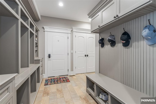 mudroom with light hardwood / wood-style flooring