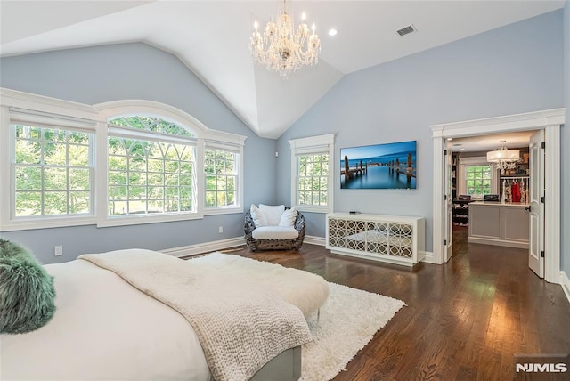 bedroom featuring a chandelier, a baseboard heating unit, dark hardwood / wood-style flooring, and lofted ceiling