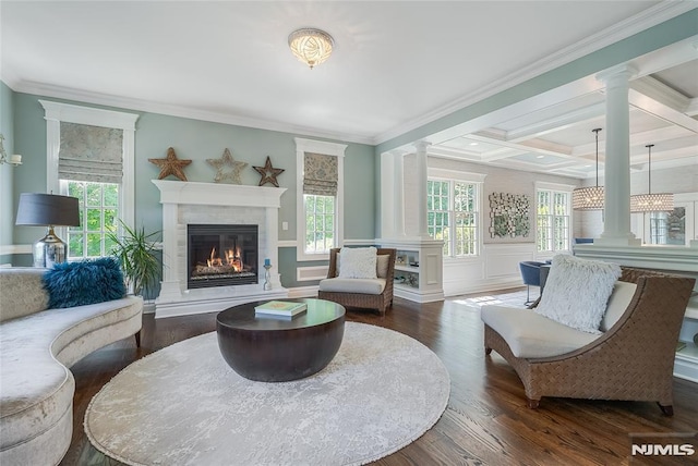 living area featuring beamed ceiling, dark hardwood / wood-style flooring, crown molding, and coffered ceiling