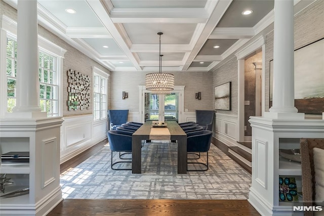 dining room featuring an inviting chandelier, coffered ceiling, crown molding, hardwood / wood-style flooring, and beamed ceiling