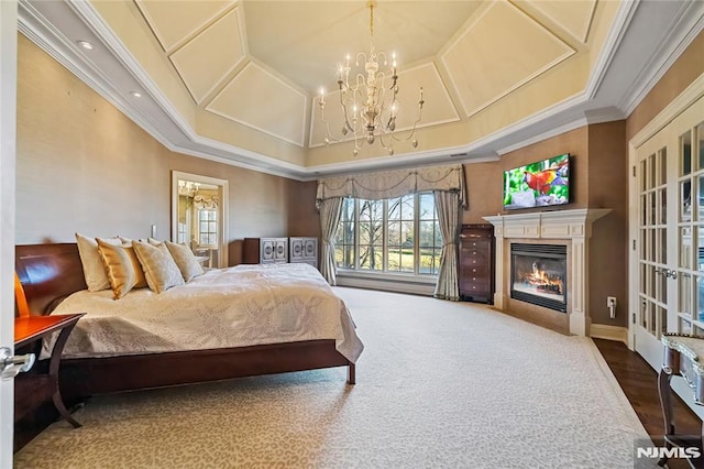 carpeted bedroom with an inviting chandelier and crown molding