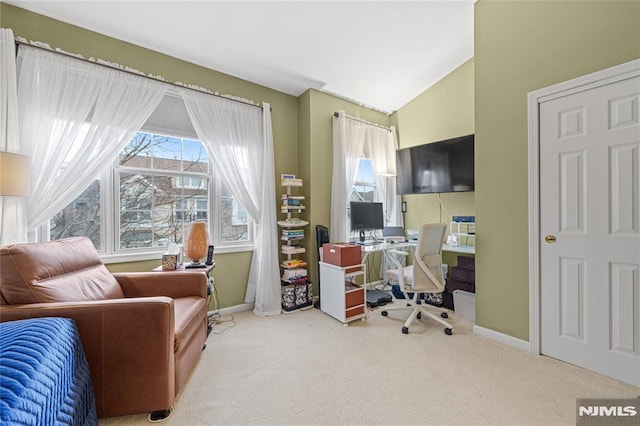 office with lofted ceiling and carpet floors