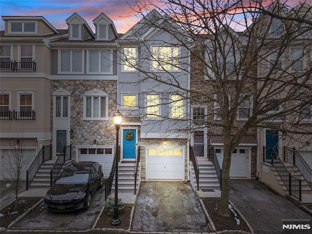 townhome / multi-family property featuring a garage