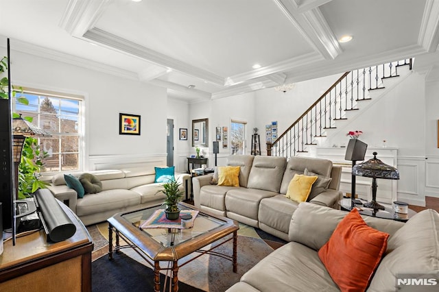 living room with crown molding and beamed ceiling