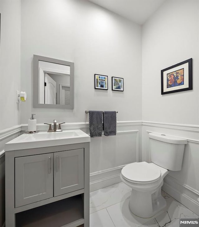 bathroom with vanity and toilet