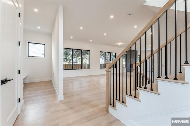 staircase with wood-type flooring