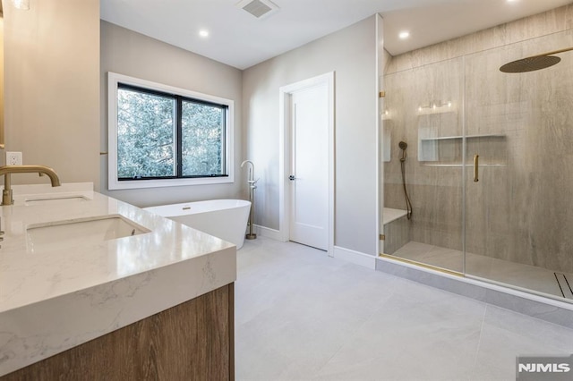 bathroom with plus walk in shower and vanity