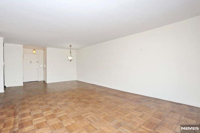 spare room with parquet flooring