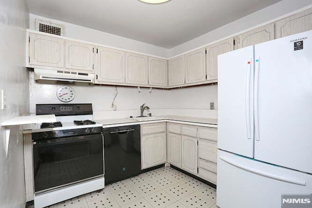 kitchen with sink, white refrigerator, dishwasher, and gas range