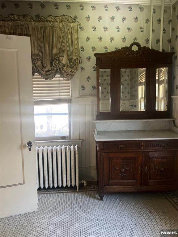 bathroom featuring vanity and radiator heating unit