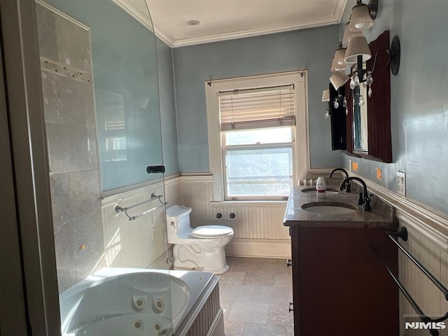 bathroom with ornamental molding, toilet, tile patterned floors, a bathtub, and vanity