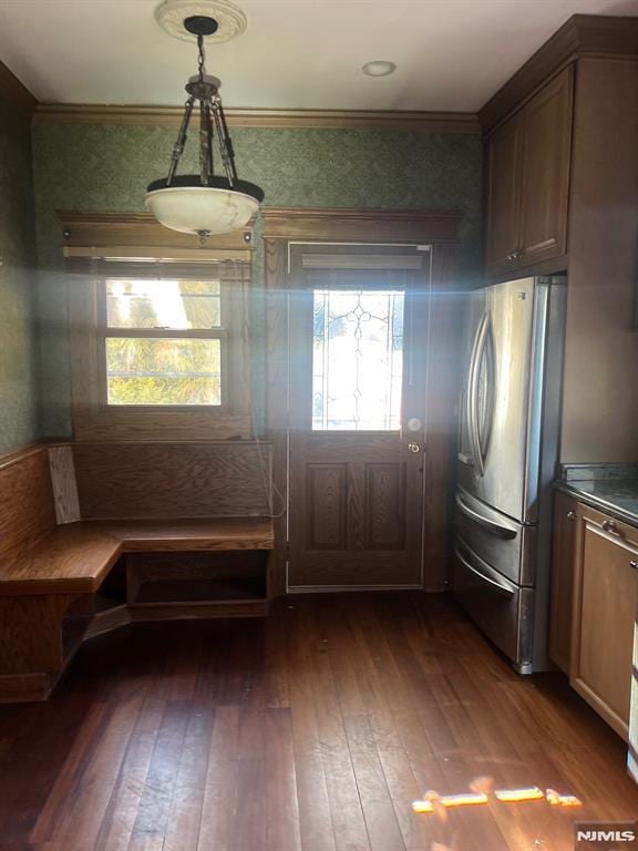 interior space with dark wood-type flooring and ornamental molding