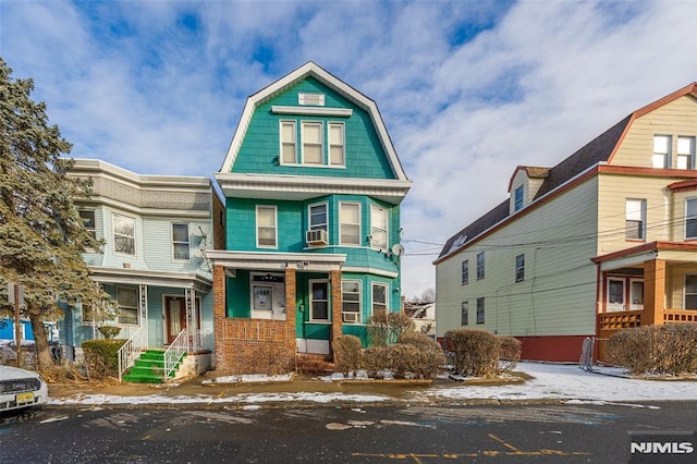 victorian home featuring cooling unit