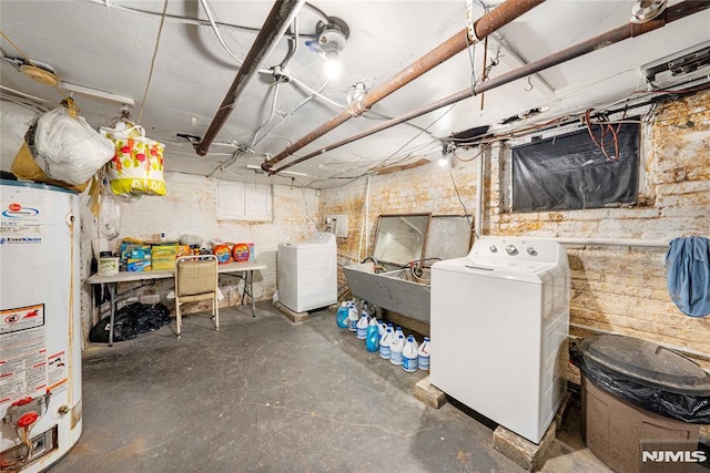 basement featuring washer / clothes dryer and water heater