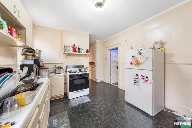 kitchen with crown molding, sink, and white appliances