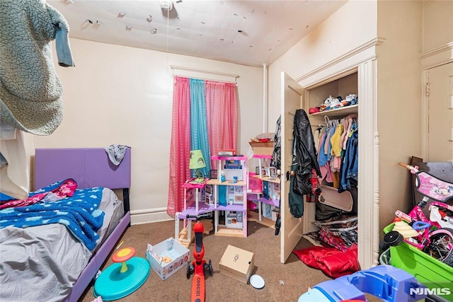 carpeted bedroom with a closet