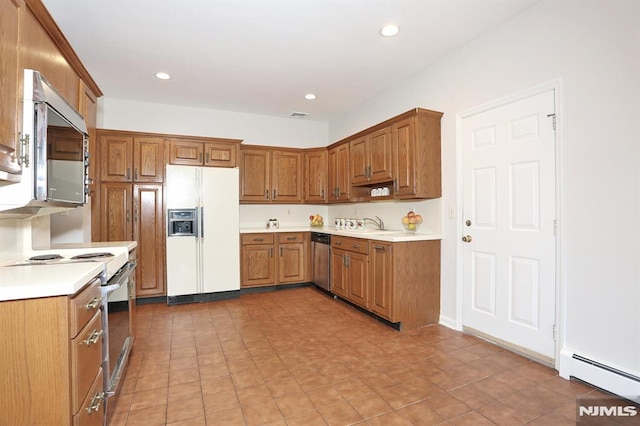 kitchen featuring a baseboard heating unit and appliances with stainless steel finishes