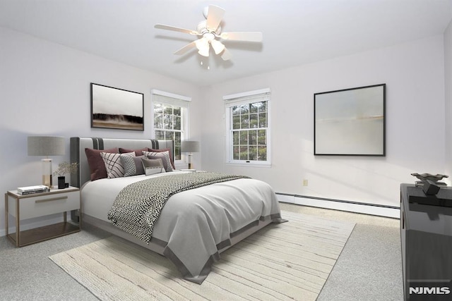 bedroom featuring ceiling fan, a baseboard heating unit, and light carpet