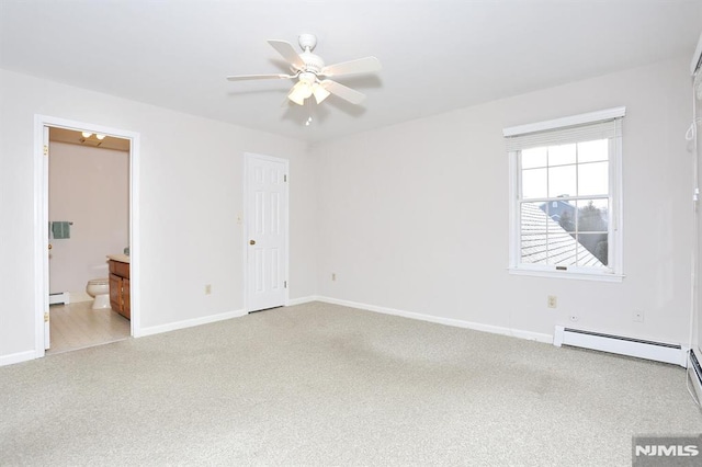 unfurnished room featuring a baseboard heating unit and ceiling fan