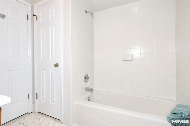 bathroom featuring shower / tub combination and tile patterned flooring