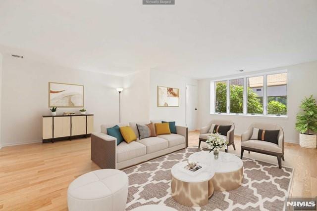 living room with light hardwood / wood-style flooring