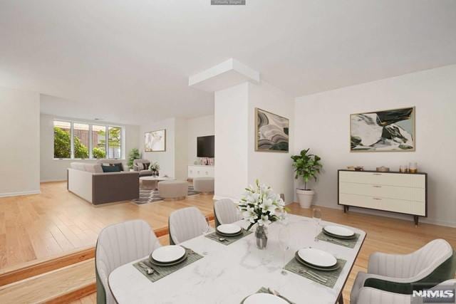 dining space featuring light wood-type flooring