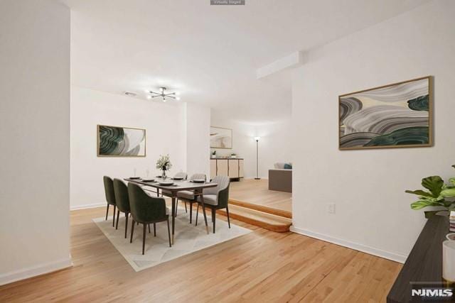 dining space featuring hardwood / wood-style flooring