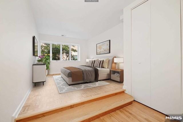 bedroom with wood-type flooring