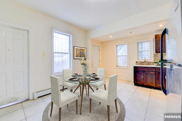 dining space with light tile patterned floors