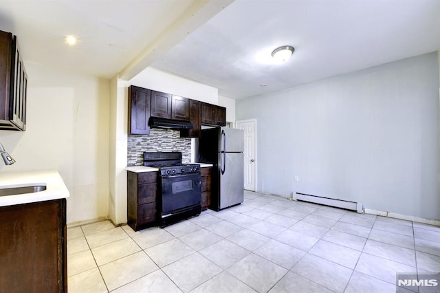 kitchen with gas stove, stainless steel refrigerator, a baseboard heating unit, backsplash, and dark brown cabinets