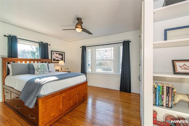 bedroom featuring hardwood / wood-style flooring and ceiling fan