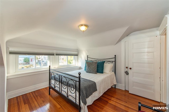 bedroom with hardwood / wood-style flooring