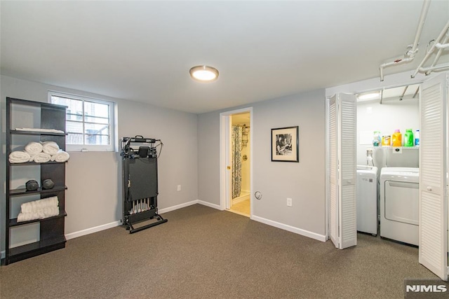 workout area featuring washer and clothes dryer