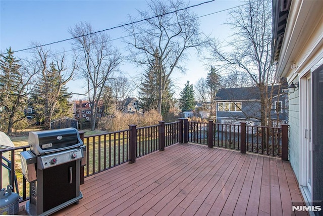 wooden terrace with grilling area