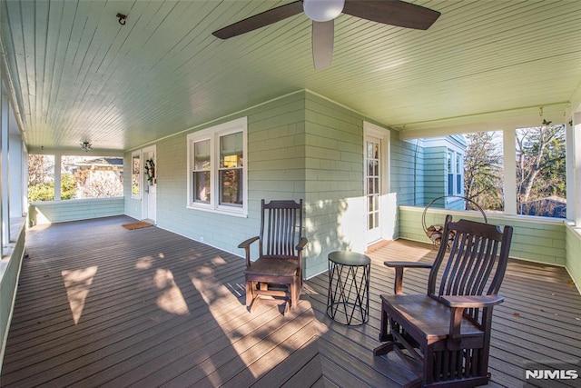 deck featuring ceiling fan and a porch