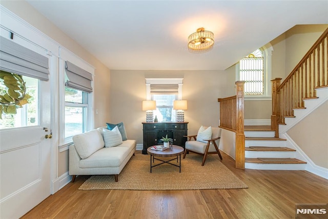 living area with plenty of natural light and wood-type flooring